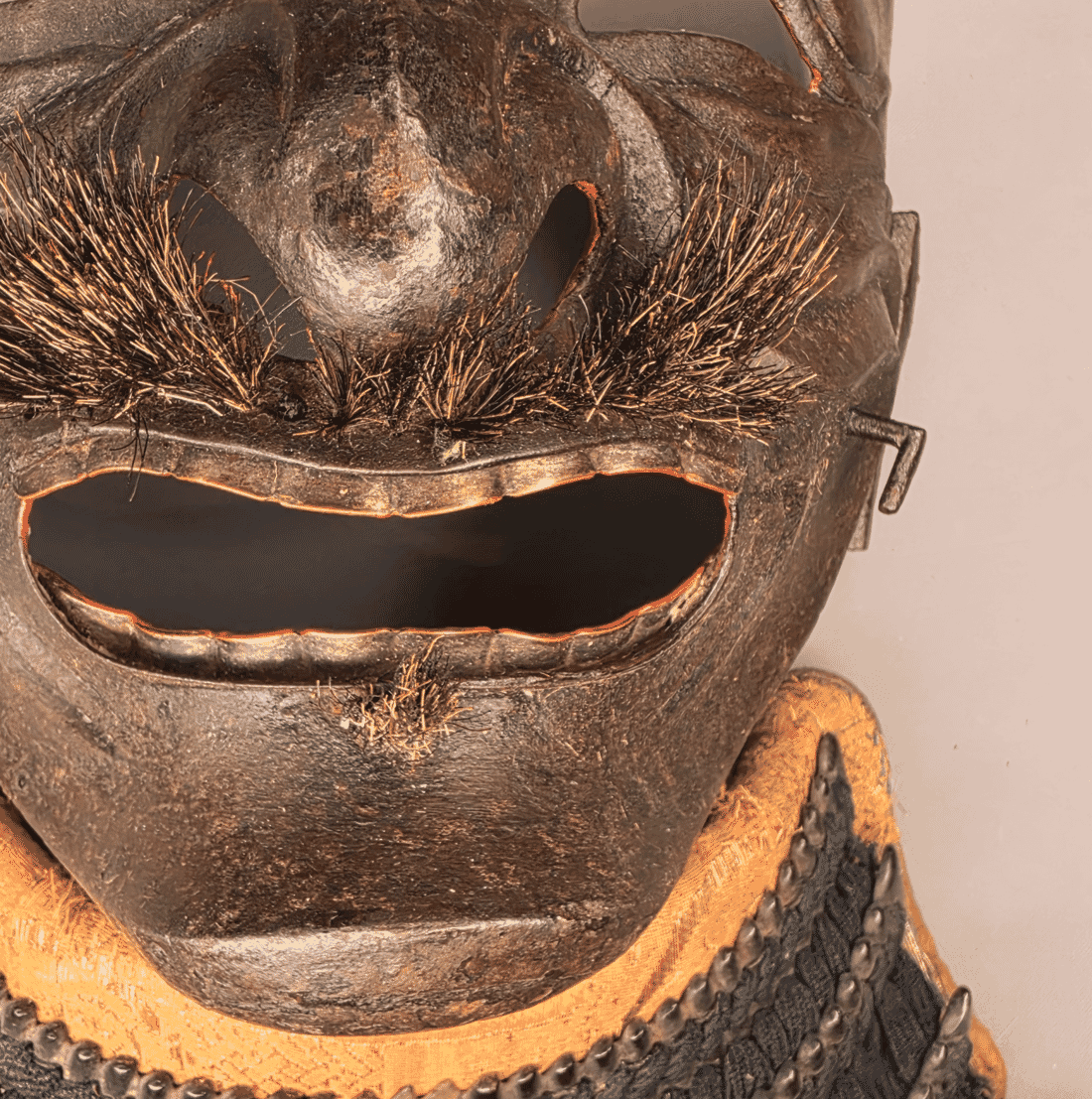 Close detail of the Myochin somen mouth and applied moustache