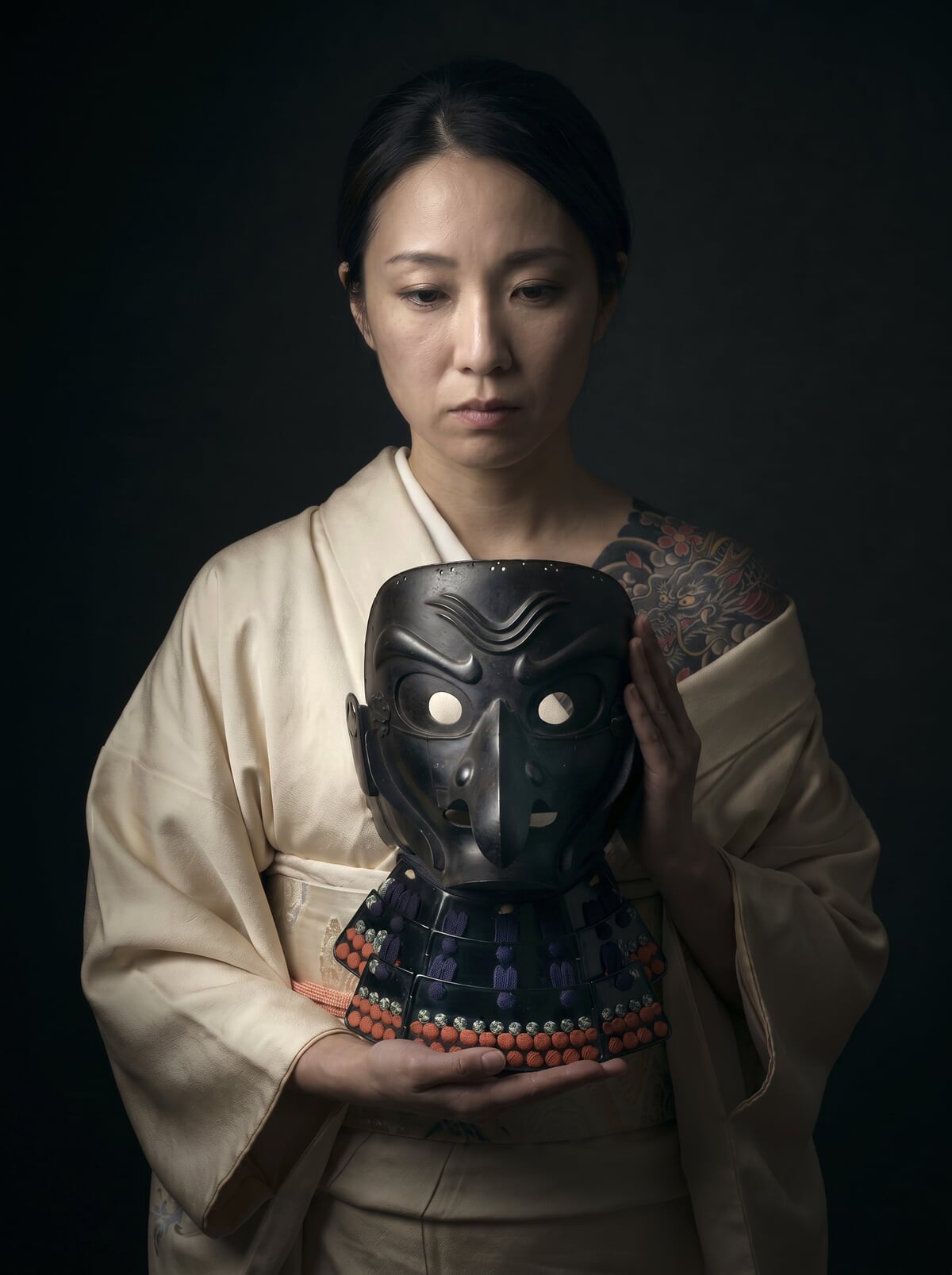 Japanese Tengu Sōmen face mask held by a woman in kimono