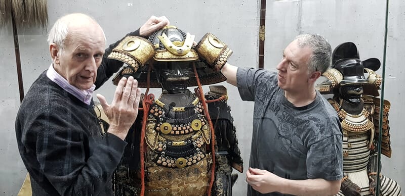 David Thatcher and Ian Bottomley assembling the Katō clan armour inside the main display case at the Samurai Art Museum Berlin