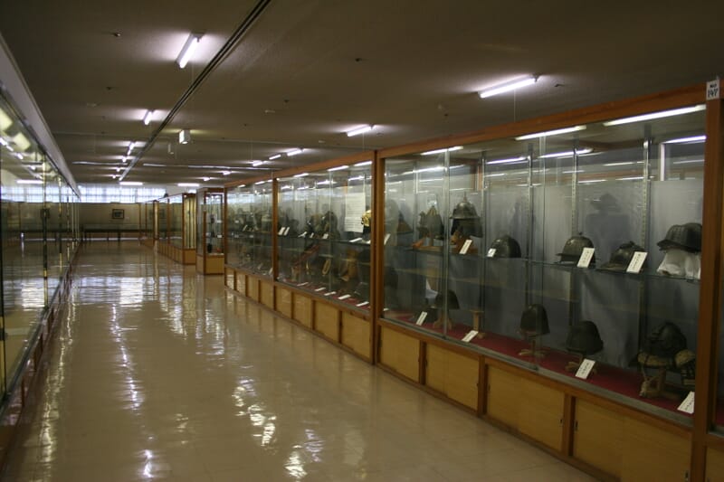 Display case housing multiple kabuto at the Watanabe Art Museum, Tottori